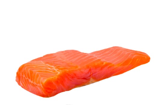 A piece of fillet of trout. Photographed close-up on a white background.