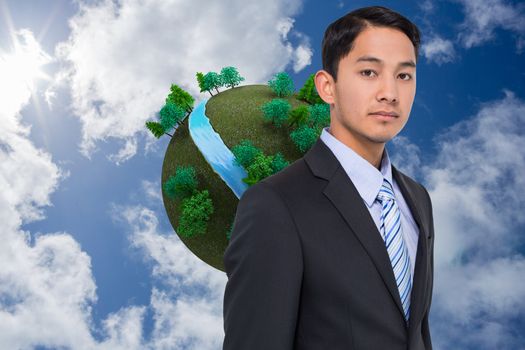 Composite image of serious asian businessman 