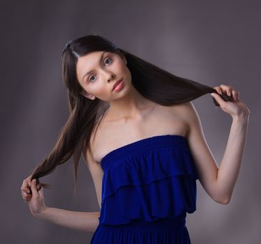 Glamour portrait of beautiful woman model with fresh daily makeup and romantic hairstyle.