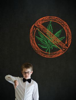 Thumbs down boy dressed up as business man with no weed marijuana on blackboard background