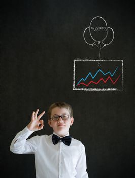 All ok or okay sign boy dressed up as business man with chalk success graph and balloon on blackboard background