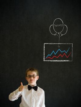 Thumbs up boy dressed up as business man with chalk success graph and balloon on blackboard background