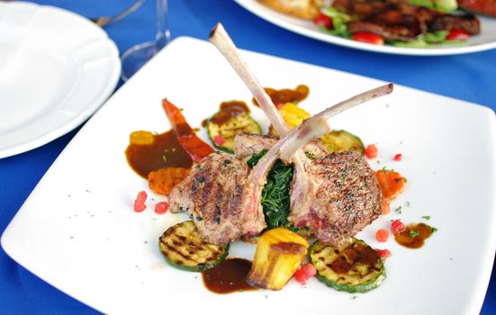 Lamb steak with sauce and boiled vegetables 