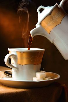 Serving fresh hot coffee with sugar cubes aside.