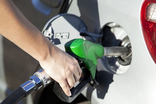 Refueling vehicle at gas station