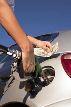 Refueling vehicle at gas station