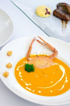 A bowl of crab cream soups with nice decorate, Gourmet food