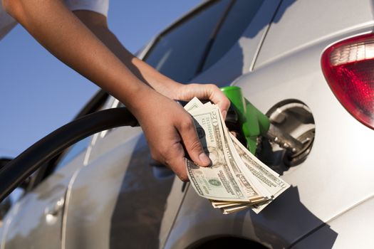 Refueling vehicle at gas station