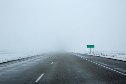 US snowing I 15 interstate snowed road in Nevada USA