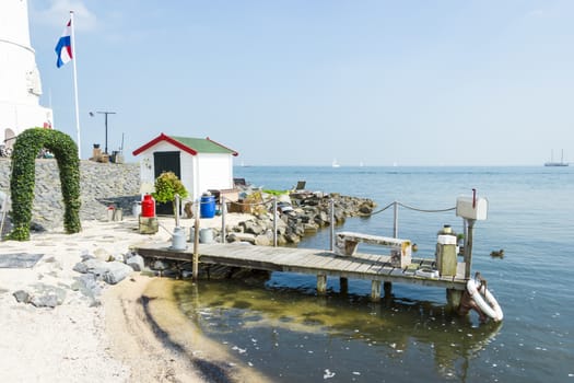 Picturesque pier near the lighthouse, Marken, Netherlands