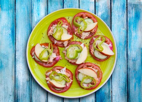 Mediterranean salad with tomato cheese cucumber pepper and apple