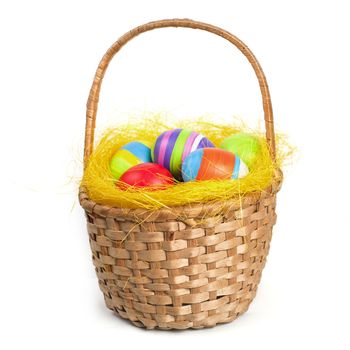 Coloured easter eggs in a braided basket