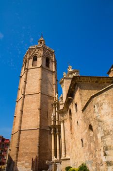 Valencia Cathedral facade and Miguelete Micalet in Plaza de la Reina at Spain