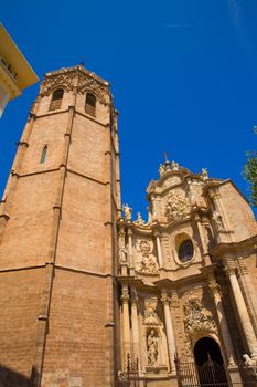 Valencia Cathedral facade and Miguelete Micalet in Plaza de la Reina at Spain