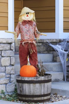 Halloween scarecrow with pumpkin