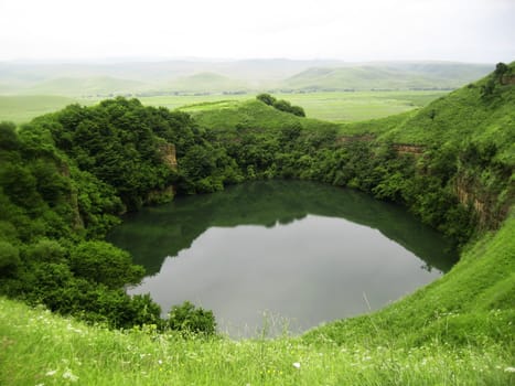 Sarmakovo lake between a caucasus mountains summertime