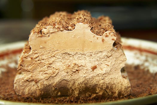 Chocolate ice cream and hardered chocolate over