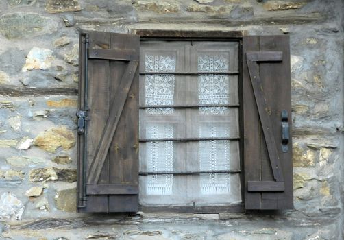 old window and rocky wall