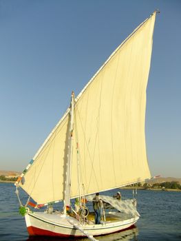 Felucca boat on the Nile river bank, Aswan, Egypt