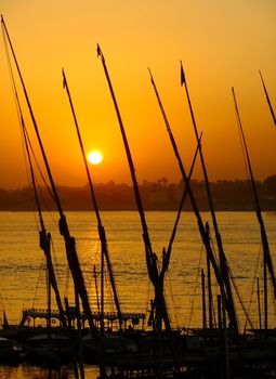 Felucca boats at the harbor at sunset, Luxor, Egypt