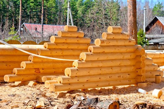 Harvesting roof for log houses from round timber with the bottom groove