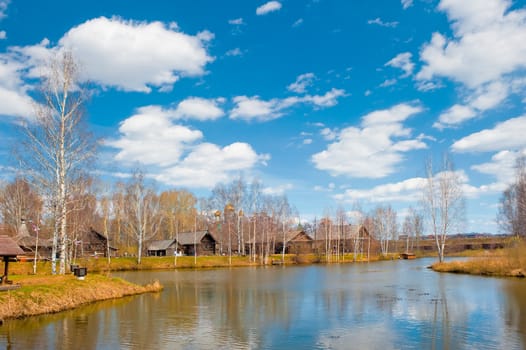 Rural landscape with a pond in the Russian village