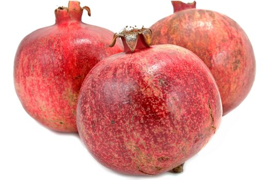 Ripe pomegranates isolated on white background