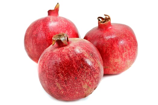 Ripe pomegranates isolated on white background