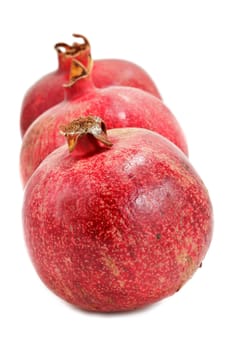 Ripe pomegranates isolated on white background