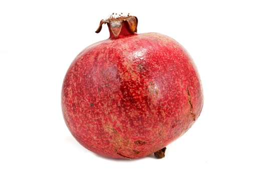 Ripe pomegranate isolated on white background