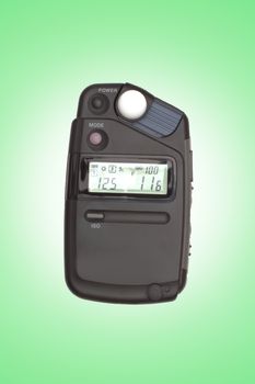 Digital flashmeter, isolated on green backrgound