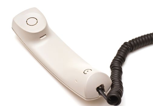 Telephone receiver and cord on white