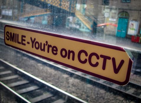 CCTV Sticker Sign On A Train Window In A Station