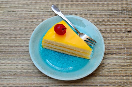 Orange cake in blue dish, Dessert time