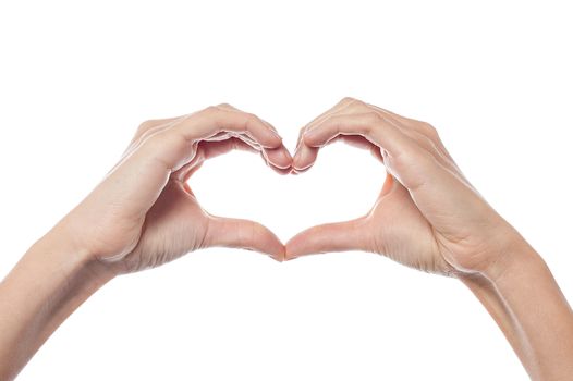 Woman hands make heart sign on the white background
