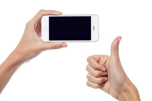 Cropped image of woman hand holding new cellphone