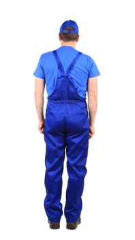 Worker in blue overalls. Back view. Isolated on a white background.