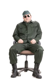 Worker in glasses sitting on chair. Isolated on a white background.