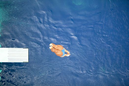 High diver jumping into the water