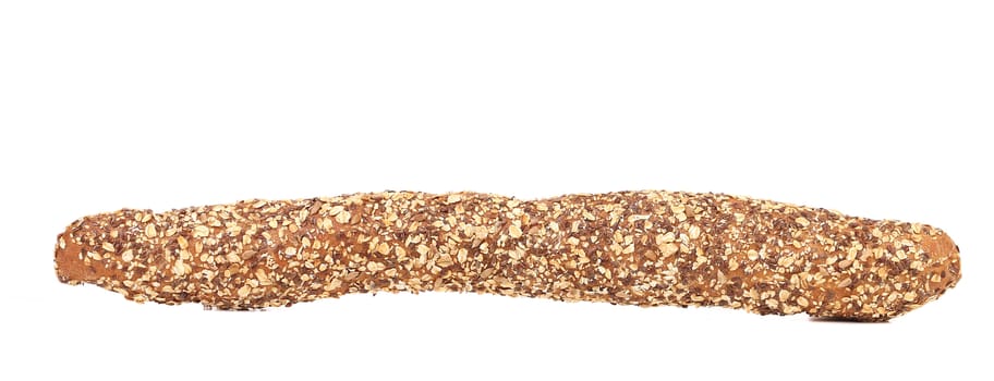 Bread with oat flakes and sesame seeds. Isolated on a white background.