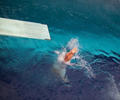 High diver jumping into the water