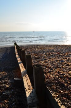 Wooden coastal sea defence breakwater along the Southern coast of England.
