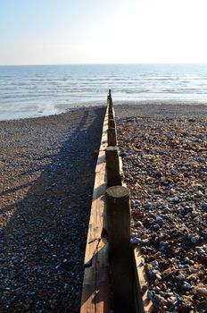 Wooden coastal breakwater sea defence in Southern England.
