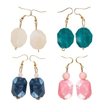 Earrings made of plastic Imitation pearl Isolated on white background. Collage