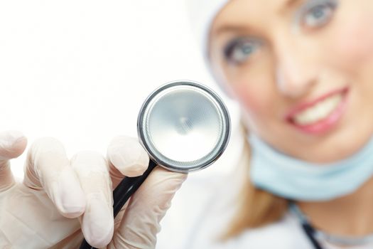 Close-up photo of the stethoscope in the hand of female doctor. Focus on stethoscope