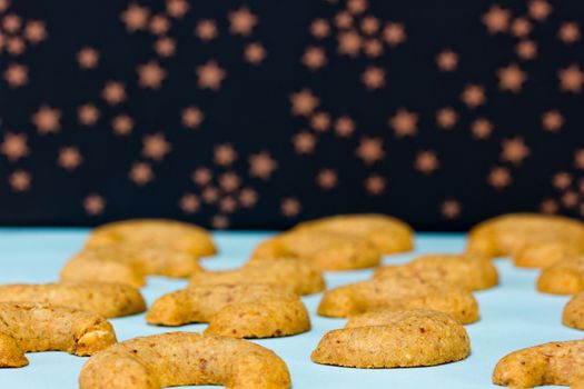 Fresh baked vanillekipferl with starry background