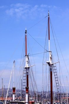 rigging of a sail boat with the blue sky in the background