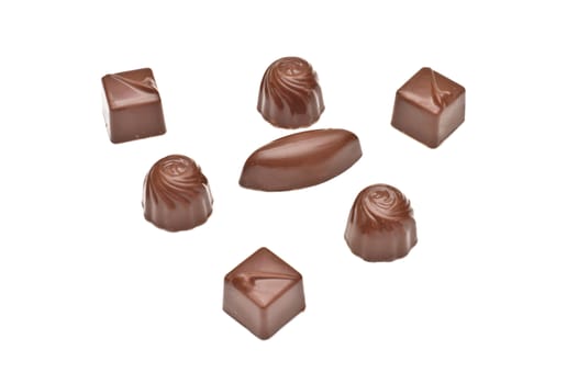 Chocolate pralines on white background