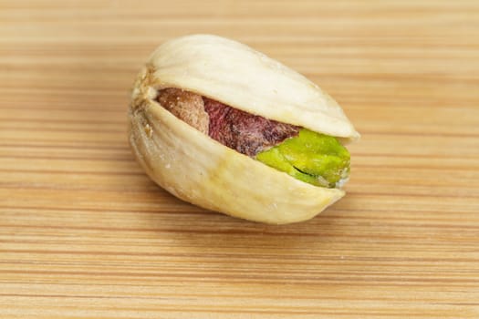 Pistachio nut on wooden board