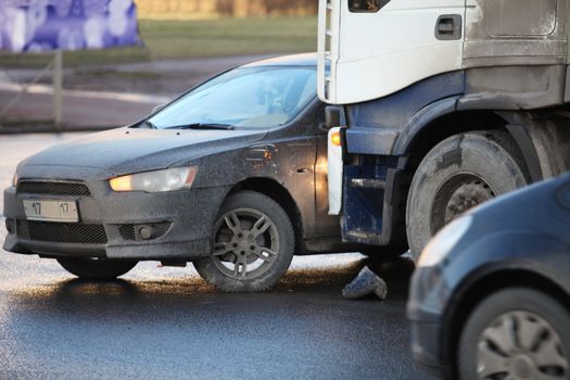 collision of the truck and car on a busy road